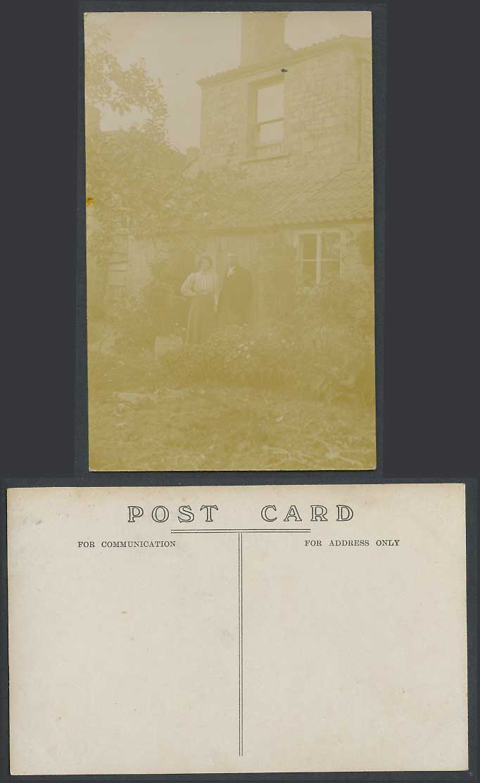 Man and Woman standing in Garden, House in background Old Real Photo Postcard