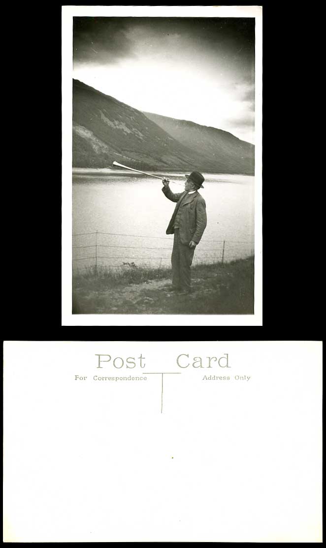 A Man playing Trumpet Horn Mountains Lake or River Scene Old Real Photo Postcard