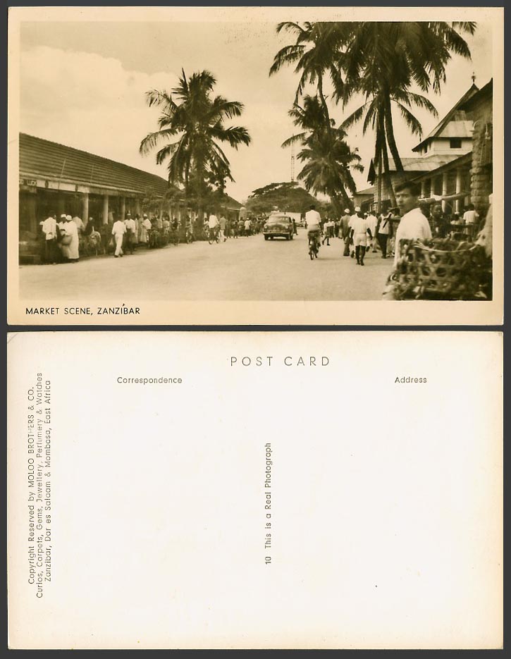 Zanzibar Old RP Postcard Market Scene, Native Street Cyclists Bicycle Palm Trees